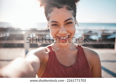 Fitness, black woman and portrait smile for selfie, vlog or profile picture by beach for running exercise. Happy African American female runner smiling for social media, memory or post by ocean coast