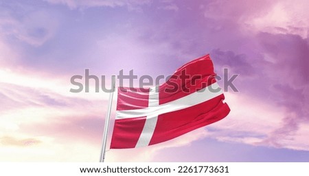 Denmark national flag waving in the sky.