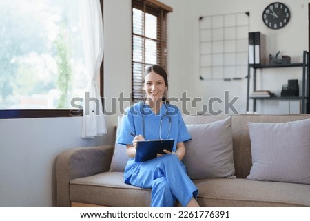 Portrait of female doctor holding patient diagnosis papers