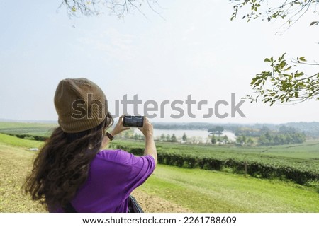Woman hand using phone taking photo beauty nature forest
