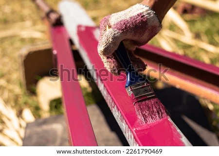 Rust-proof painted steel pipes in the factory. Red iron pipe. Rust-proof paint, water pipes