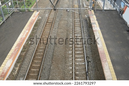 two railroad tracks at a train station
