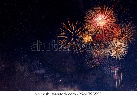 Fireworks with blur milky way background Royalty-Free Stock Photo #2261795555