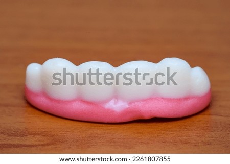 Colorful Fruity Gummy Candy. Halloween Jelly candies in the form of teeth with fangs