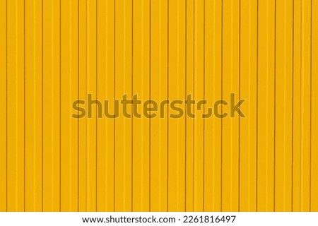 Bright yellow profiled metal wall, fence or warehouse idea, background for screen or design ideas