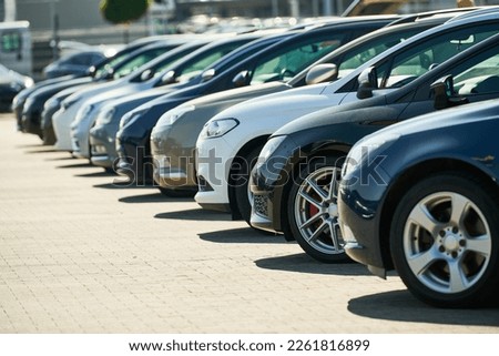 row of used cars. Rental or automobile sale services Royalty-Free Stock Photo #2261816899