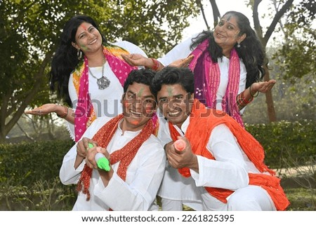 Portrait of an Indian family celebrating Holi together