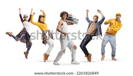 Cheerful young men and women with a boombox dancing isolated on white background