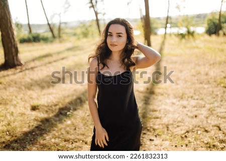 Young woman walking in forest
