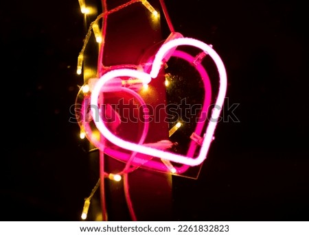 Multicolored neon heart on the street. Valentine's Day