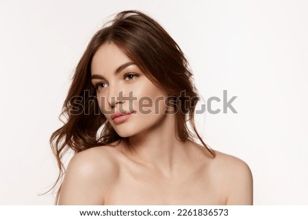 Well-kept skin. Portrait of young beautiful woman with perfect smooth skin isolated over white background. Concept of natural beauty, plastic surgery, cosmetology, cosmetics, skin care.