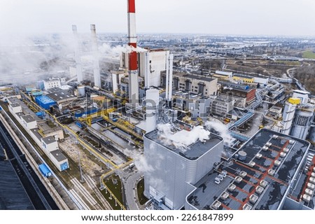 Aerial view of Zeran heat power station with smoke emissions from the chimney in Warsaw, Poland. High quality photo Royalty-Free Stock Photo #2261847899
