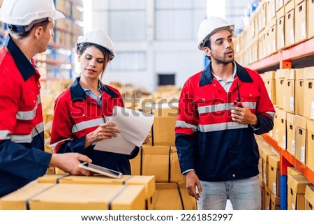 Engineer team shipping order detail check goods and supplies on shelves with goods background inventory in factory warehouse.logistic industry and business export
