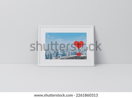 Red fabric heart love air balloon on rock mountain over city tower poster in horizontal white frame on floor over grey wall, Valentines day concept, 3D rendering