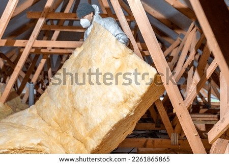 insulation of the roof and ceiling with glass wool