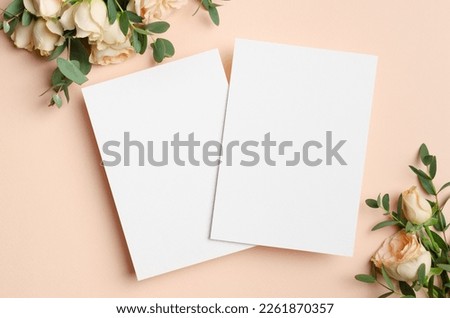 Blank wedding invitation card mockup with flowers, save the date card mockup with copy space Royalty-Free Stock Photo #2261870357
