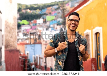 Mexican man visiting colorful Guanajuato historic center. Royalty-Free Stock Photo #2261872241
