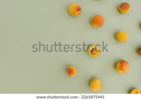 Fruit pattern of fresh peaches on pastel green background