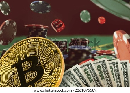 Bitcoin Gambling - The concept of chips and cards for playing poker on the background of a flying cards Royalty-Free Stock Photo #2261875589