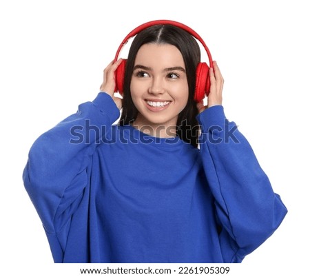 Teenage girl with headphones on white background
