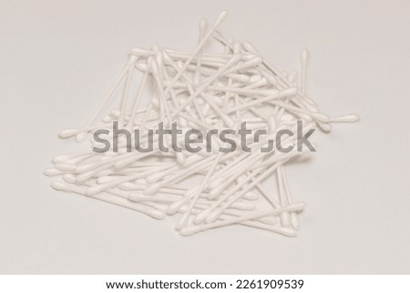 Group of white cotton buds isolated on a white background.