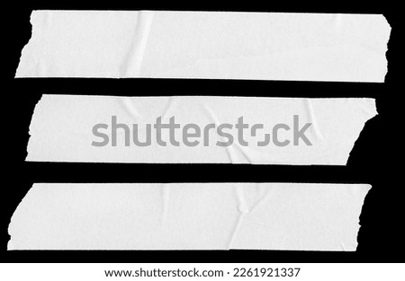 Three white Blank painter tape stickers isolated on black background. Template mockup Royalty-Free Stock Photo #2261921337