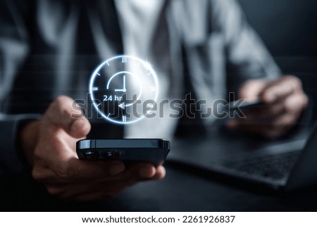 Nonstop service 24 hr online store concept. businessman in 247 online shopping service with clock for worldwide nonstop and full-time available contact of customer service. Royalty-Free Stock Photo #2261926837