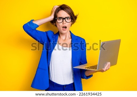 Photo of confused reaction young business lady freelancer hp netbook hand head open mouth no deals zero profit isolated on yellow color background