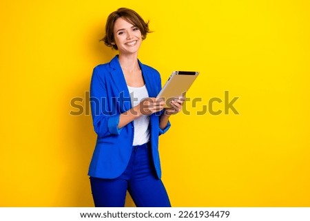 Photo of pretty shiny woman wear blue jacket chatting twitter telegram facebook empty space isolated yellow color background Royalty-Free Stock Photo #2261934479