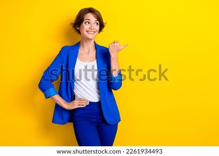 Photo of professional hr manager recruiter wear blue jacket looking opening new it company demonstrate brand isolated on yellow color background