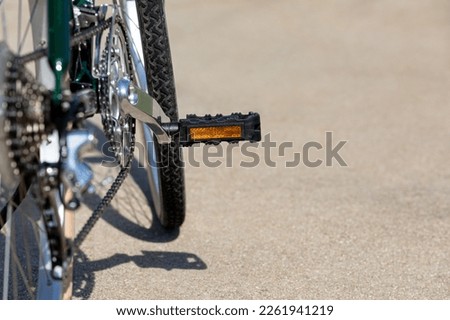 Bicycle with reflector pedal on road during summer. Cycling, biking, and outdoor exercise concept. Royalty-Free Stock Photo #2261941219