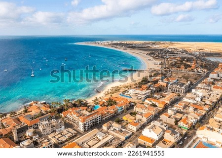 Pier and boats on turquoise water in city of Santa Maria, Sal, Cape Verde Royalty-Free Stock Photo #2261941555