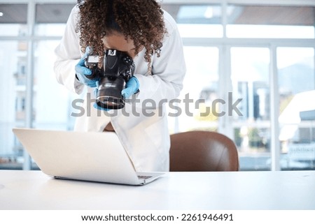 Science investigation, camera and black woman with laptop in laboratory for forensic research with evidence. Photography, police and girl take picture for crime analysis, analytics and observation