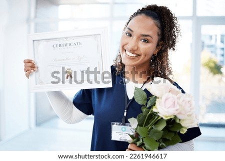 Certificate, rose and portrait with a black woman graduate in the hospital, proud of her achievement. Smile, graduation and qualification with a happy young female nurse standing alone in a clinic Royalty-Free Stock Photo #2261946617