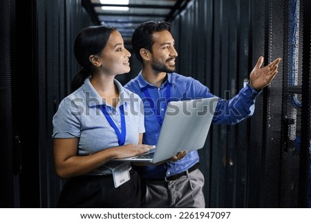 Server room, laptop and manager people or technician in data center management, system and cyber security. Teamwork, inception and engineering or programmer employees, information technology and code Royalty-Free Stock Photo #2261947097