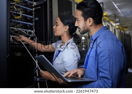Man, woman or server room maintenance on laptop IT, software programming ideas or cybersecurity engineering. People, repair or data center technology in teamwork collaboration of safety analytics fix Royalty-Free Stock Photo #2261947473