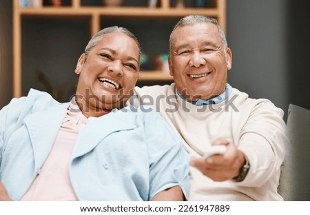 Love, portrait and senior couple watching tv, having fun and laughing at comic movie in living room. Valentines, romance and elderly retired man and woman streaming funny comedy video on television.