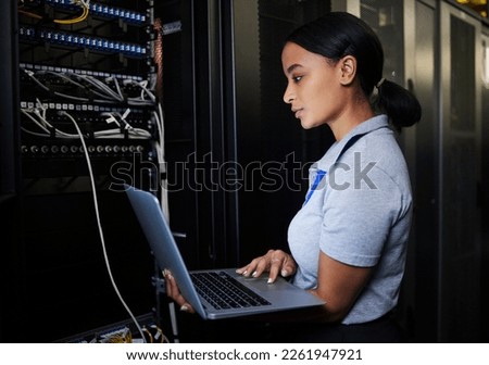 Engineer, laptop database and woman in server room for software update or maintenance at night. Cybersecurity coder, cloud computing and female programmer with computer for networking in data center. Royalty-Free Stock Photo #2261947921