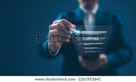 Business performance monitoring concept, businessman using smartphone Online survey filling out, digital form checklist, blue background. Royalty-Free Stock Photo #2261953641