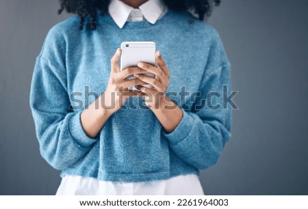 Phone, hands or black woman search in studio for social media content, networking or reading blog post update. Website, startup or girl with smartphone for communication, internet news or mobile app