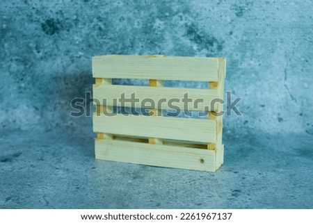 photos of miniature wooden pallets, which are photographed with a concept