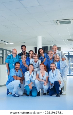 Portrait of happy doctors, nurses and other medical staff in hospital. Royalty-Free Stock Photo #2261969781