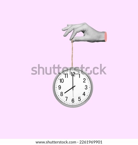 Human hand hold an office clock. Time concept