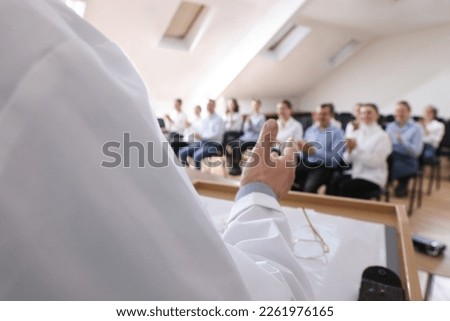 Doctor giving lecture during medical conference in meeting room, closeup Royalty-Free Stock Photo #2261976165