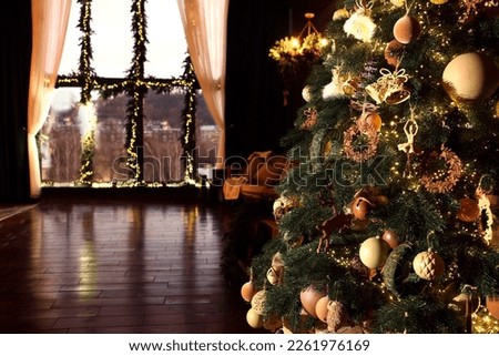 Beautiful Christmas tree in room with festive decor