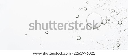 The texture of a cosmetic serum with bubbles in closeup. Macrophotography Royalty-Free Stock Photo #2261996021