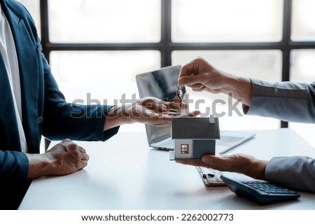Real estate agent present house and land to their client by offering example of model home Introducing home loan loan, preliminary installment Offer idea for mortgage loan and home insurance.