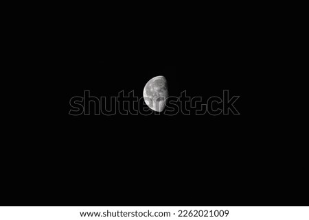 Moon half covered by black background