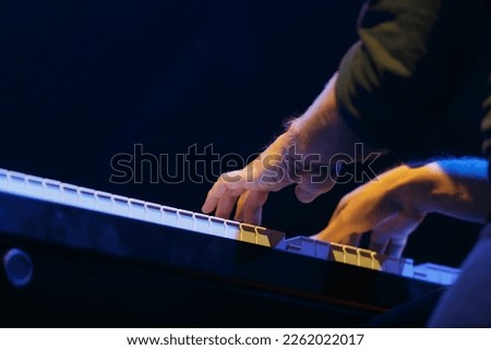 Pianist playing music on concert. Hands of piano player on synthesizer keyboard Royalty-Free Stock Photo #2262022017