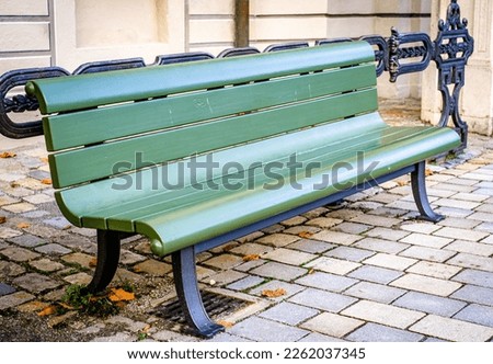typical old wooden bench - parkbench - photo Royalty-Free Stock Photo #2262037345